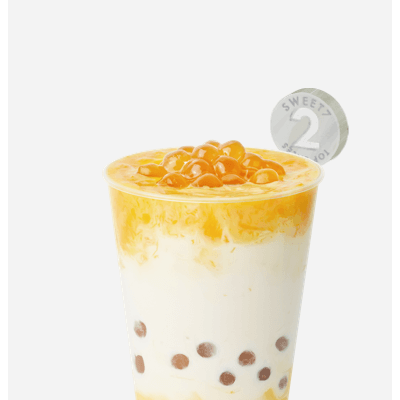 7分甜新創(chuàng)新水果奶茶，芒果果肉加入香濃牛奶，
配上清香白桃烏龍茶，Q彈珍珠增加咀嚼口感，唇齒意猶未盡
